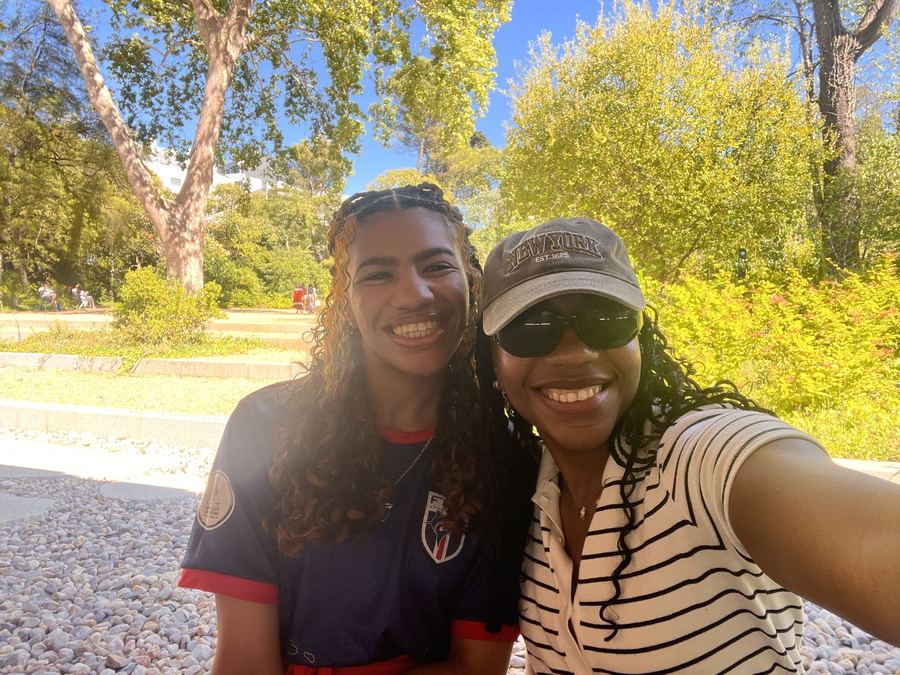 Two members taking a sunny selfie outdoors
